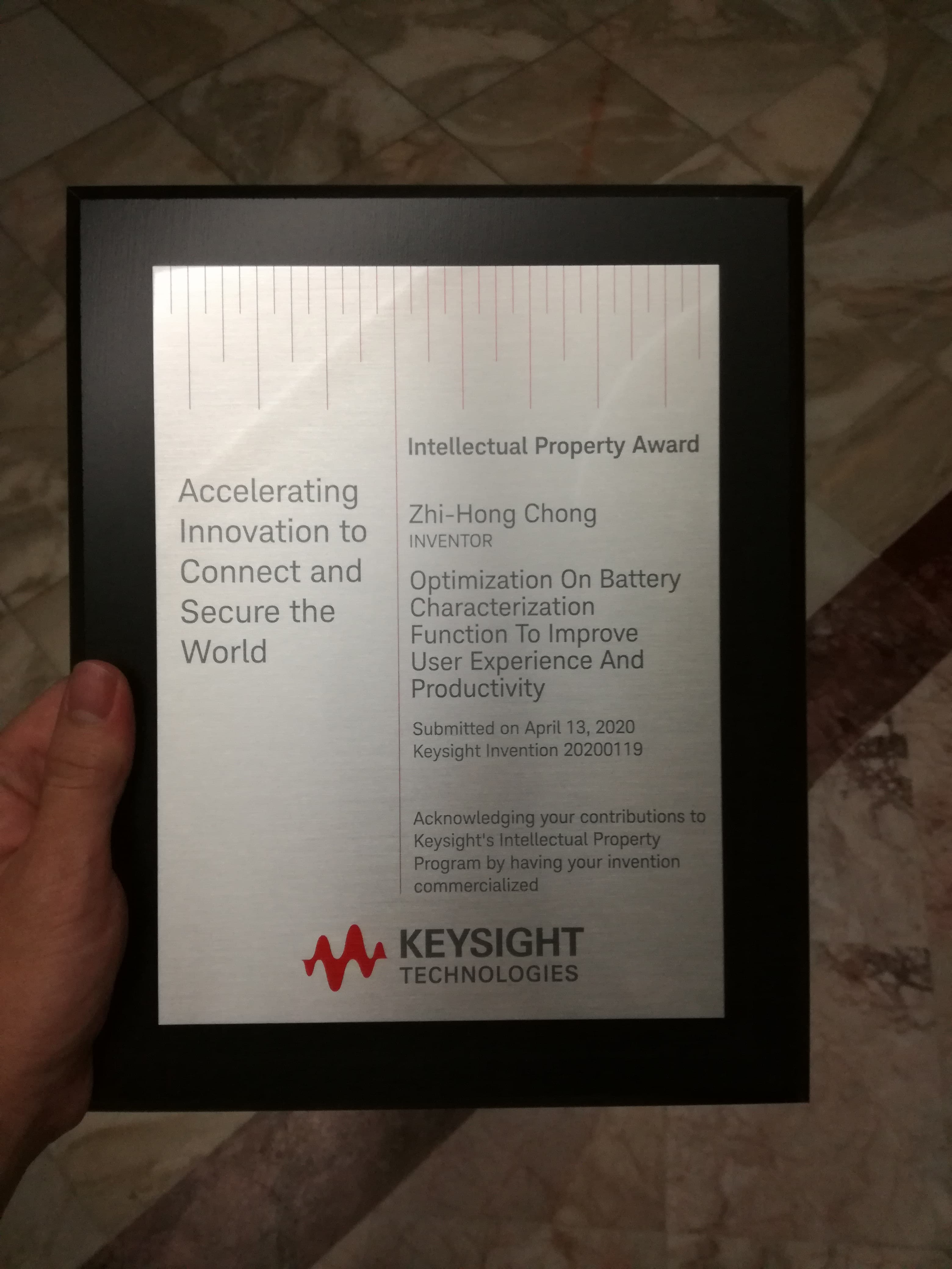 Keysight Intellectual Property Award plaque for Zhi-Hong Chong's commercialized battery characterization invention